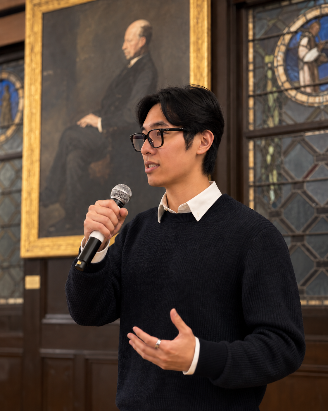 Ren Yu speaking into a microphone